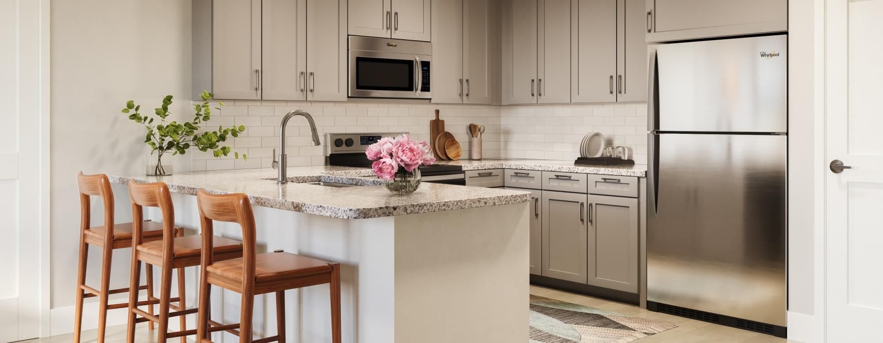 a kitchen with white cabinets