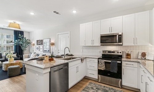 Settle into comfort at The Stafford view of the kitchen in the model from the fridge