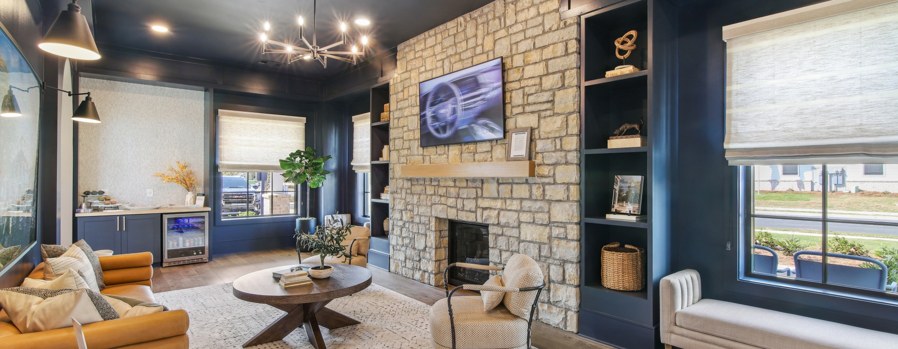 clubhouse seating with a fireplace and reading nook