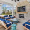 an outdoor amenity space with a fireplace 